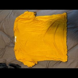 Mustard yellow shirt with green details